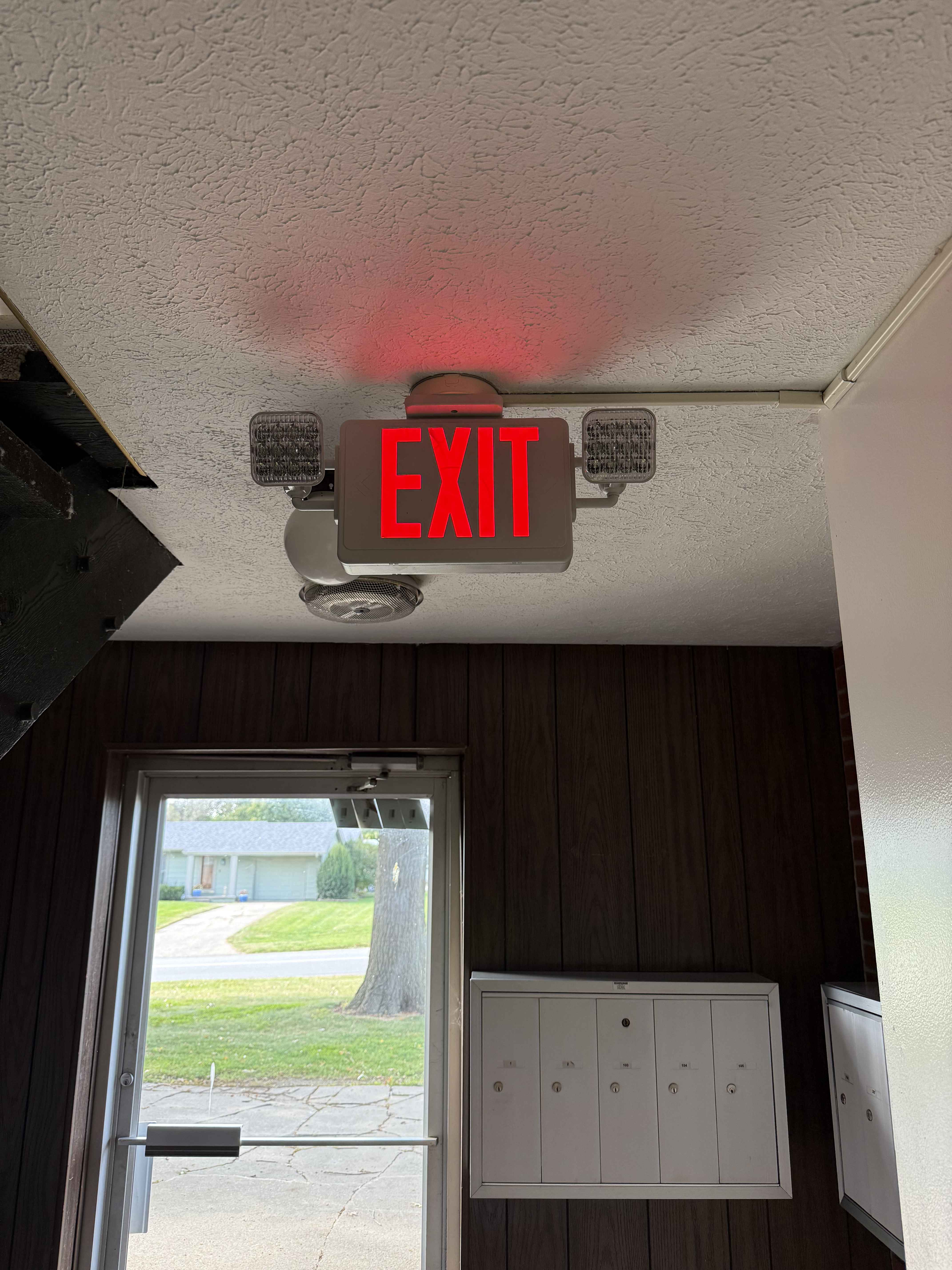 New modern EXIT sign with LED emergency lights professionally installed