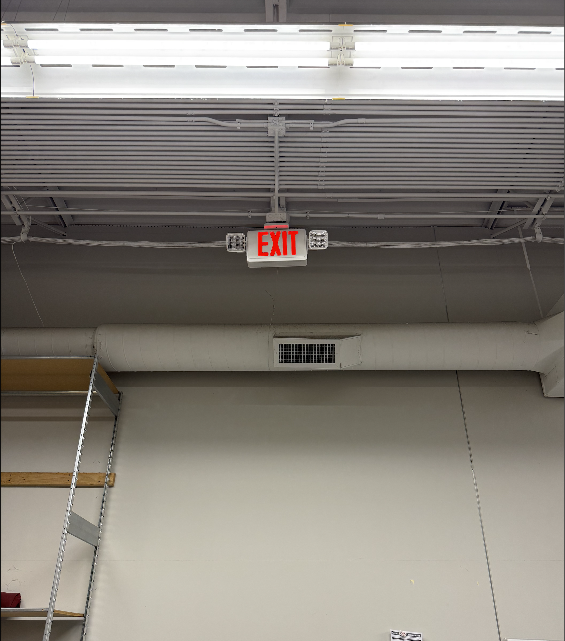 Emergency exit sign installation in commercial building