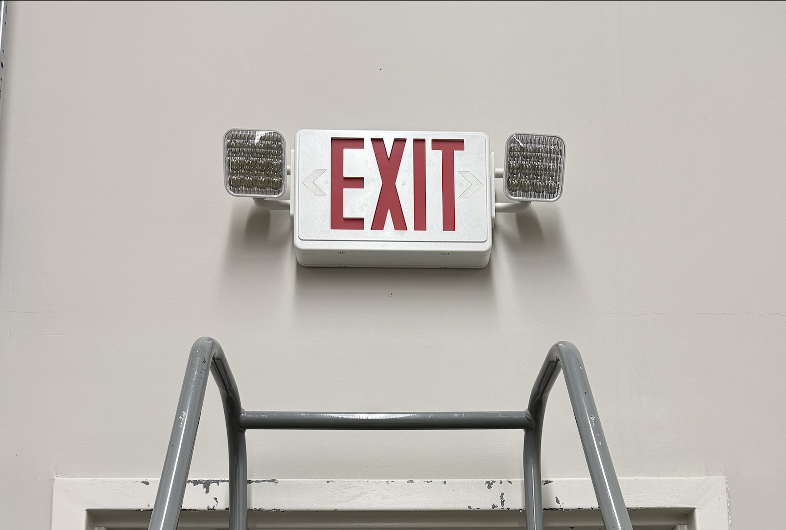 Brand new EXIT sign with emergency lights installed and operational