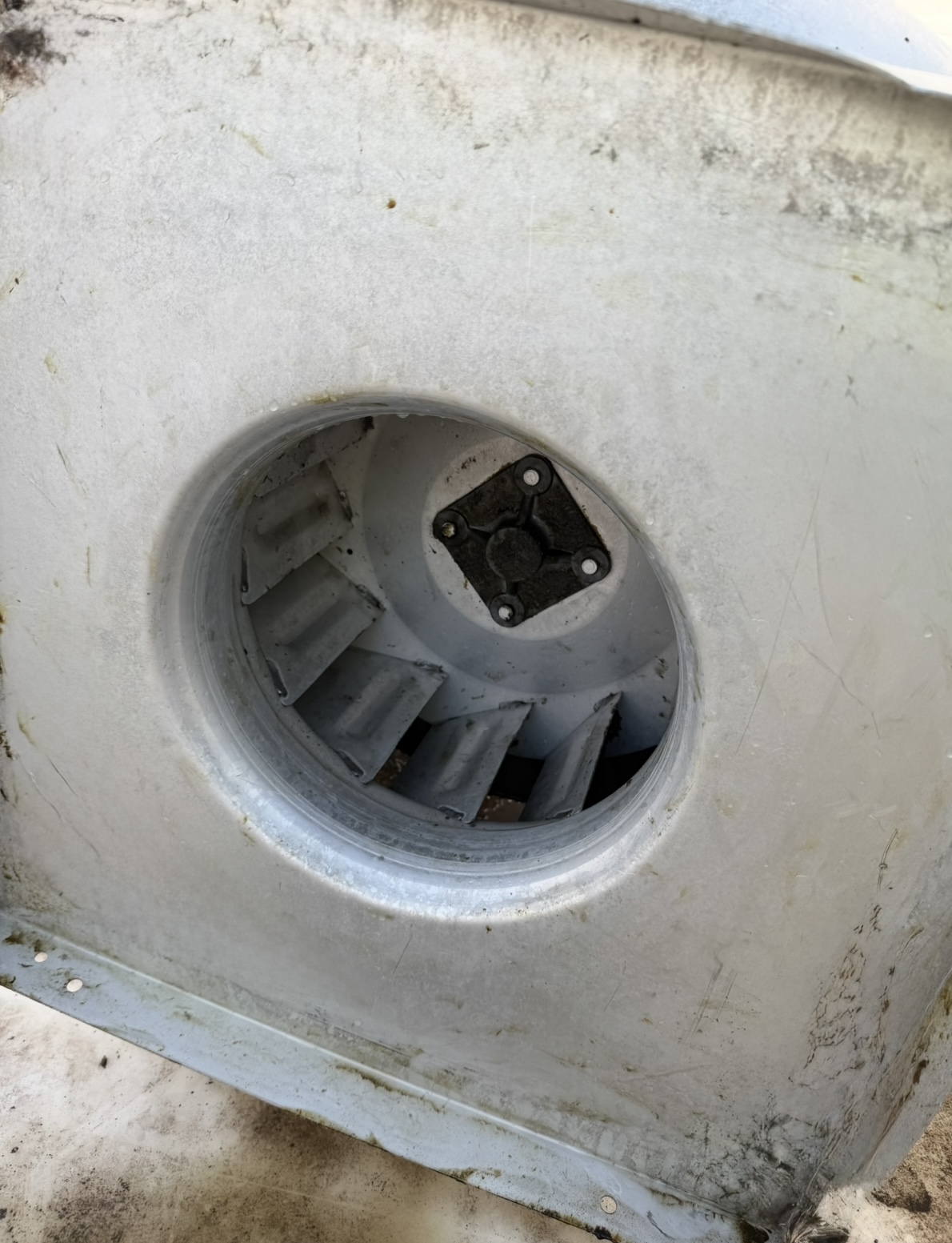 Rooftop exhaust fan restored to like-new condition after professional cleaning