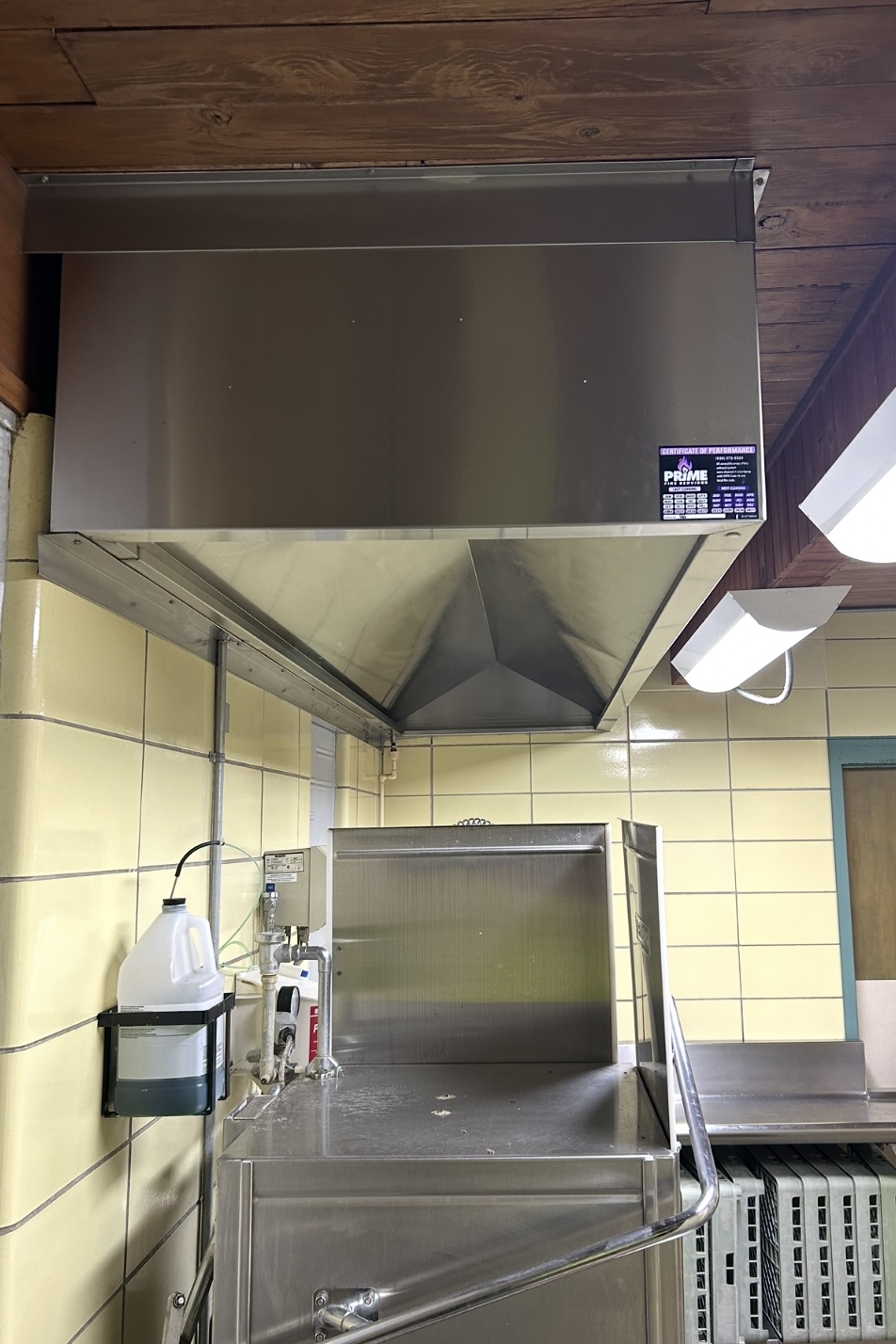Clean commercial kitchen exhaust hood after professional service